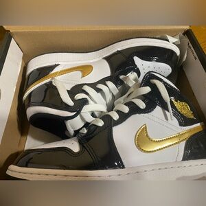 Air Jordan Mid1 SE Black and Gold